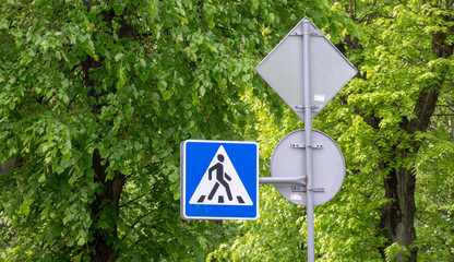 Road sign on city background
