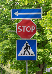 Road sign on city background
