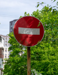 Road sign on city background