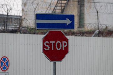 Road sign on city background