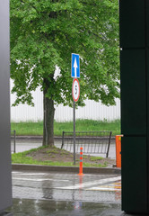 Road sign on city background