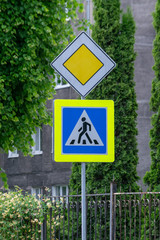 Road sign on city background