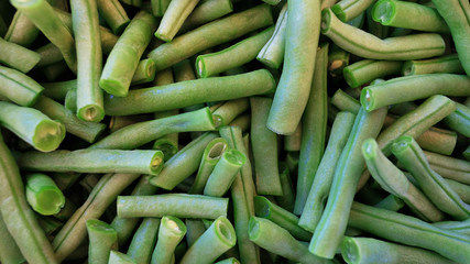 Raw french beans known also as haricot vert, cleaned and cut in short segments, ready to be used in a vegetarian or vegan dish or paired with other dishes, either blanched, fried, sauteed or steamed