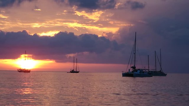 Yachts against the backdrop of a beautiful sunset in Thailand
