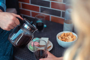 Close up of couple having breakfast and drinking coffee