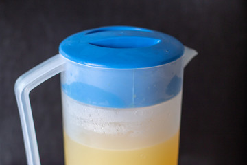 Orange juice in pitcher. Isolated on white background