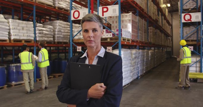Portrait of a female warehouse manager at work 4k