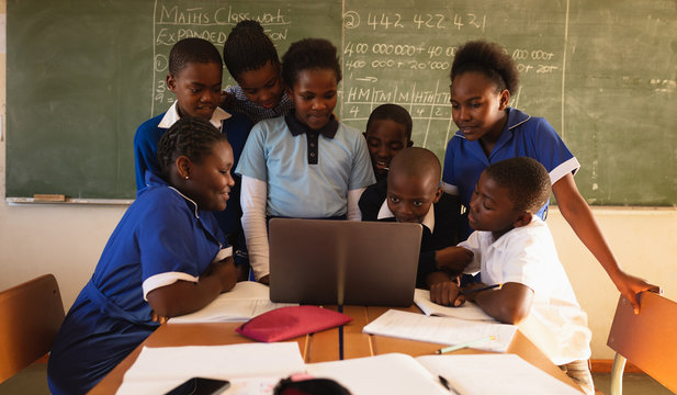 Schoolchildren with laptop in a lesson at a township school