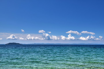 Fototapeta premium Sea view from beach. Landscape with the sea and the beautiful clouds in the blue sky