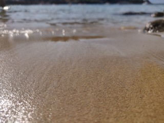 Fototapeta na wymiar Sparkles on a sand beach