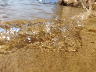 Sea bubbles on the beach
