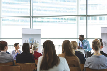 Fototapeta premium Male speaker speaks in a business seminar