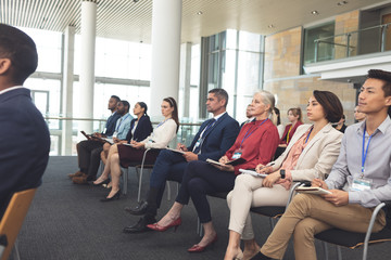 Business people attending a business seminar