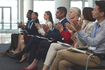 Business people applauding in a business seminar