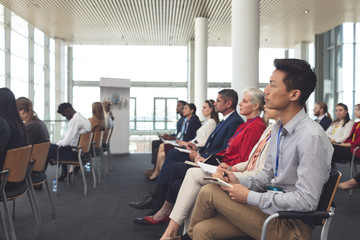 Business people attending a business seminar