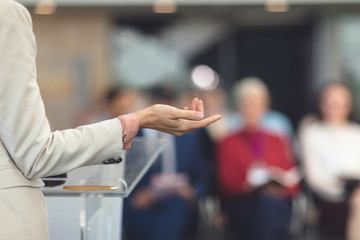 Female speaker speaks in a business seminar 