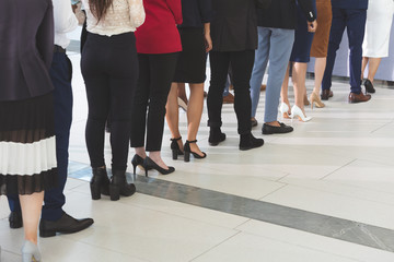 Business people checking in at conference registration table