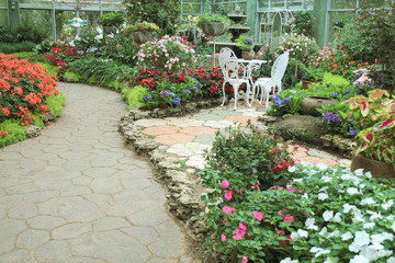 Fototapeta na wymiar path way in garden in the flowers garden.