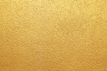 Gold concrete wall on background texture.