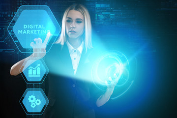 The concept of business, technology, the Internet and the network. A young entrepreneur working on a virtual screen of the future and sees the inscription: Digital Marketing