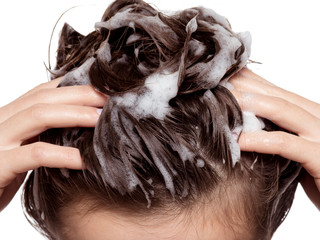 Woman soaping the hair. Beauty treatment
