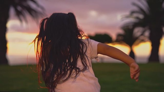Young Girl Running At Sunset