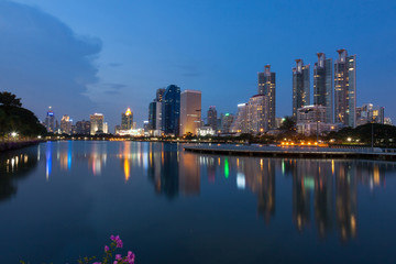 Fototapeta na wymiar Twilight time at the business district from Benjakiti Park Bangkok , Thailand