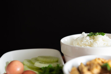 Thai cuisine, Northern of Thailand Lanna style, Hot steamed rice with crispy belly pork in chili flavor and fresh vegetables, Space for text