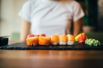 Young woman sitting at table