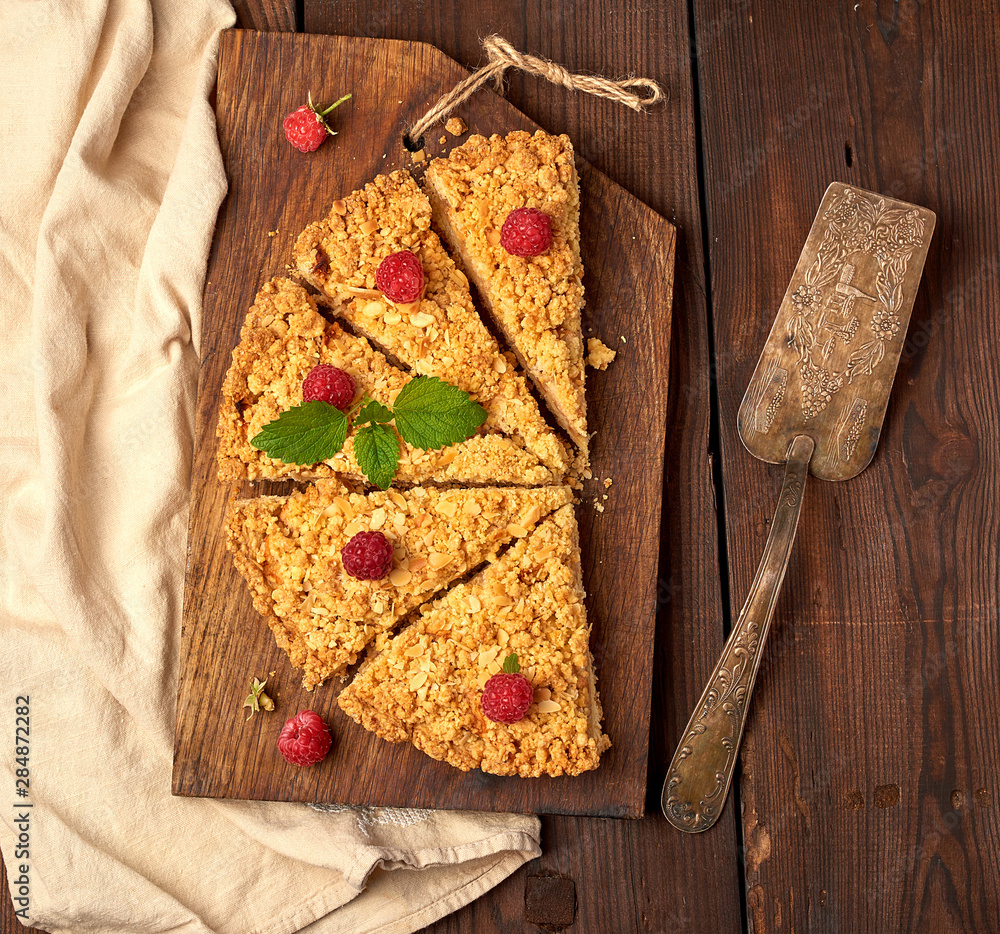 Poster sliced triangular pieces of crumble pie with apples