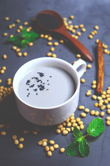 Obraz na płótnie Canvas Soy milk mix black sesame with soybean seed and black sesame seeds
