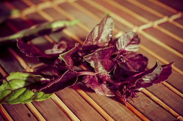 Autumn still life - asparagus beans, purple Basil on bamboo Mat