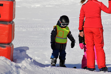 Fototapeta na wymiar Children in the skiing course