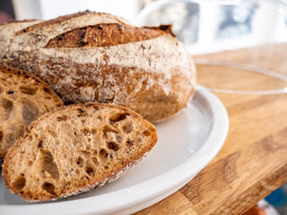 Sourdough bread. Close focus on cut sourdough bread with background bokeh copy space.