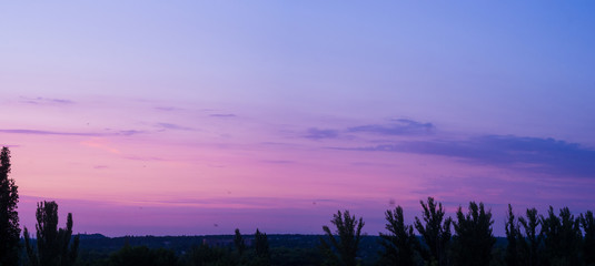 Fototapeta premium Landscape with dramatic light - beautiful golden sunset with saturated sky and clouds.