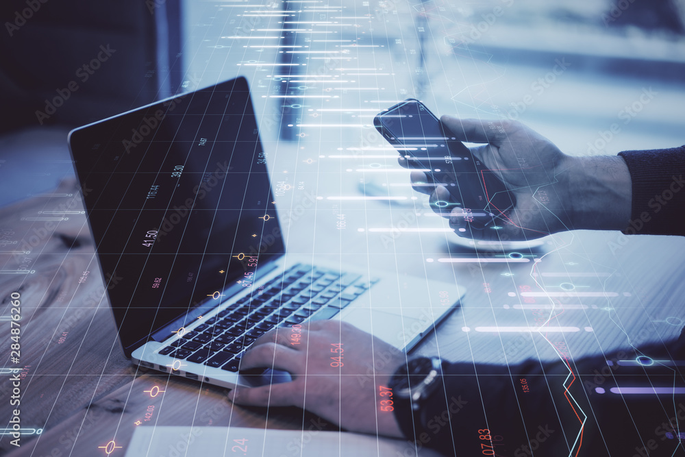 Poster hands using laptop with forex chart