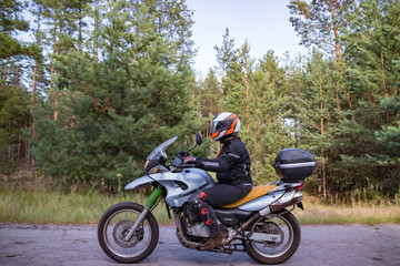 Motorcyclist biker driving on the highway