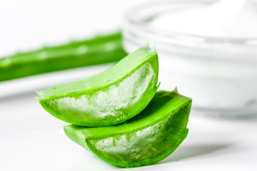 aloe vera - leaves and cream isolated on white background