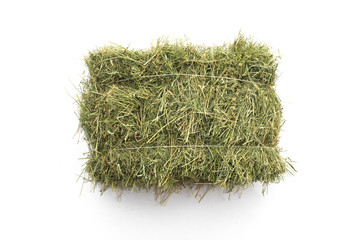 Studio shot of straw hay on a white background. - obrazy, fototapety, plakaty