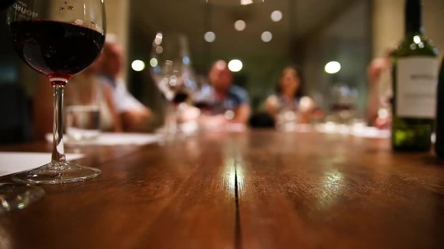 Table level shot of wine tasting activity on a wine cellar tour