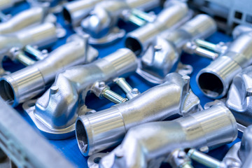 Pile of aluminum automotive parts, casting process in the automotive factory