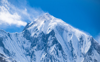Annapurna II summit with blue sky backround from Chame valley on Annapurna circuit trek in Himalaya Nepal