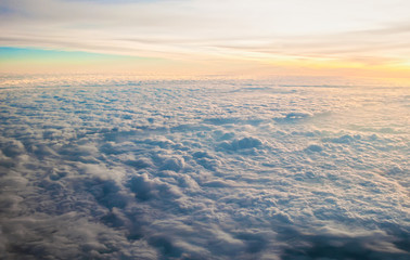 white fluffy clouds at sunrise