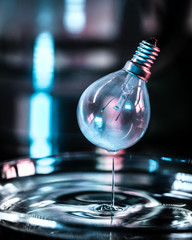 Floating Lightbulb Above Water 