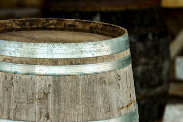Fototapeta premium Old wooden barrel with metal strips