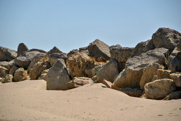 Fototapeta na wymiar rocks and sand on the beach in Andalusia