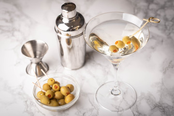glass of martini on marble background