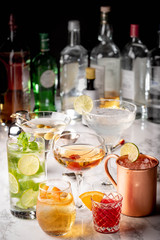 collection of classic cocktails, mojito, moscow mule,  negroni, old fashioned, manhattan, margarita, martini
