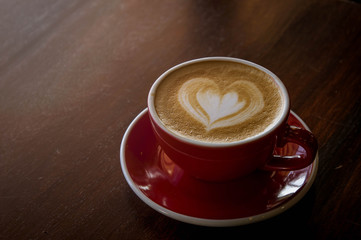 the red cup coffee love , coffee dark in wood dark table