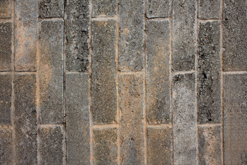 Grey wall tiles vertical texture.